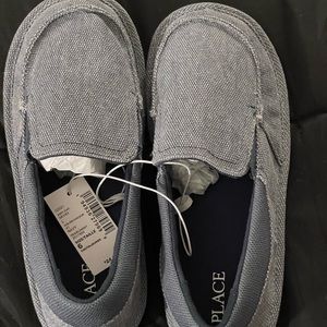 Jean colored, boy’s size 5 moccasins, never worn.